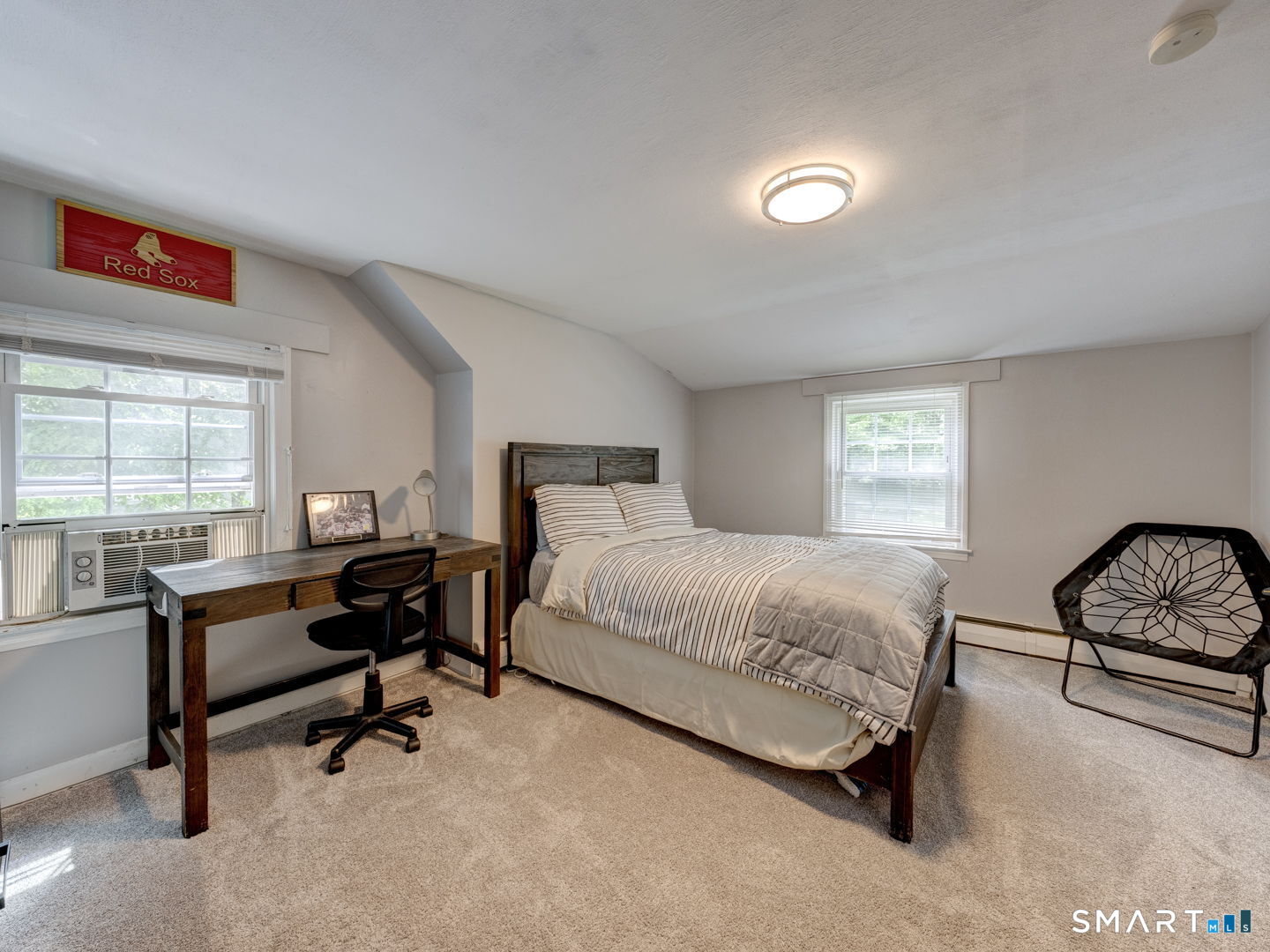 39 Freedom Drive Canton, CT 06019 - Photo 21 of 37 a bedroom with a bed a desk and chair with window