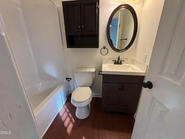 a view of a bathroom from a hallway