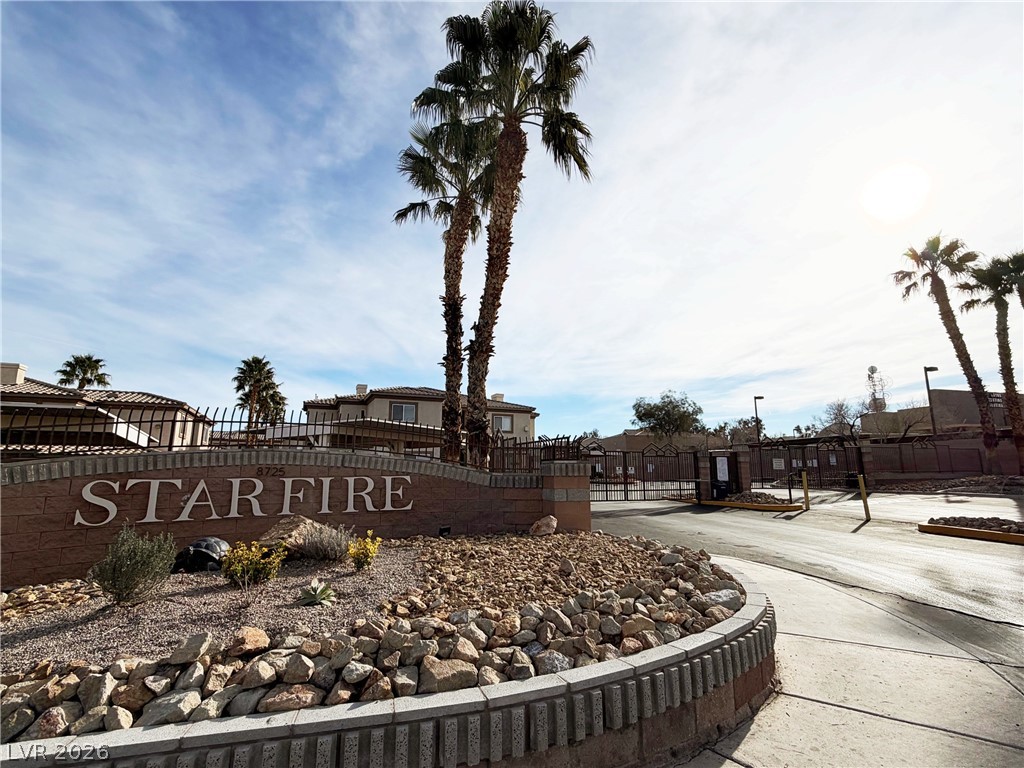 8725 West Flamingo Road, Unit 226 Las Vegas, NV 89147 - Photo 2 of 11 Community sign featuring a residential view and a gate