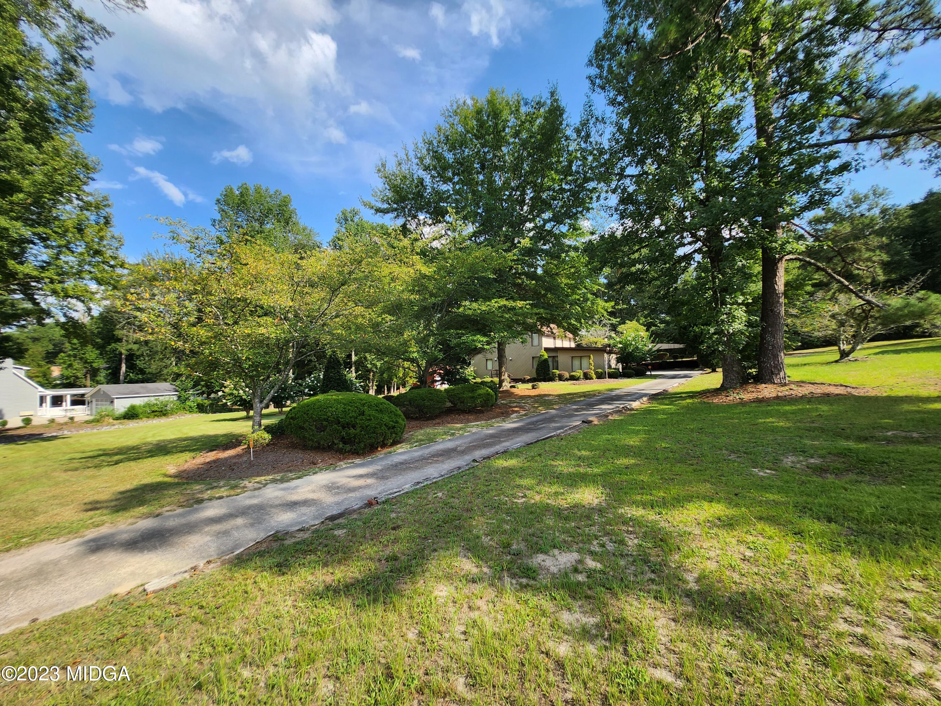 7338 Columbus Road Lizella, GA 31052 - Photo 6 of 33 a view of a park with large trees