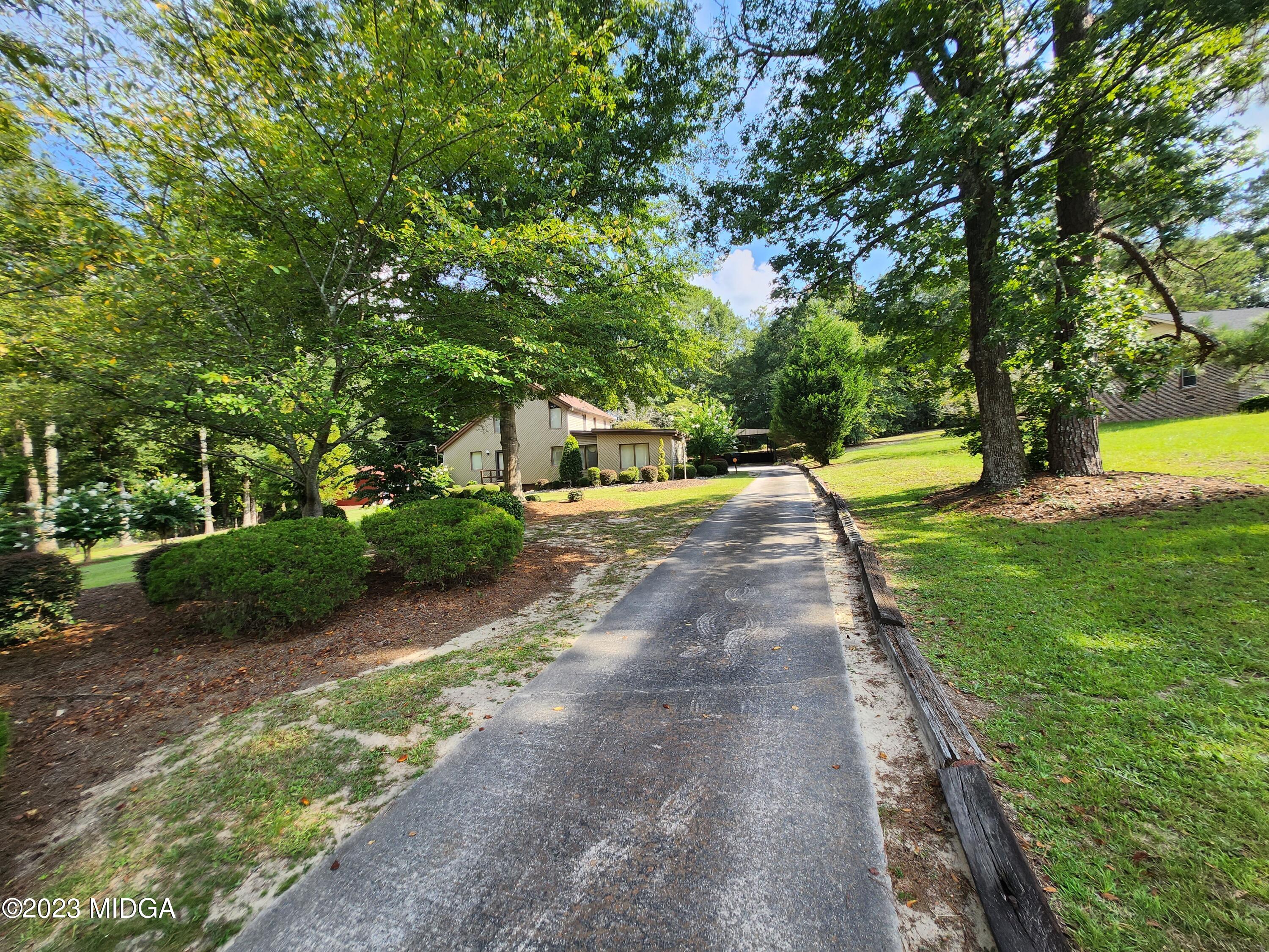 7338 Columbus Road Lizella, GA 31052 - Photo 8 of 33 a view of a backyard with green space