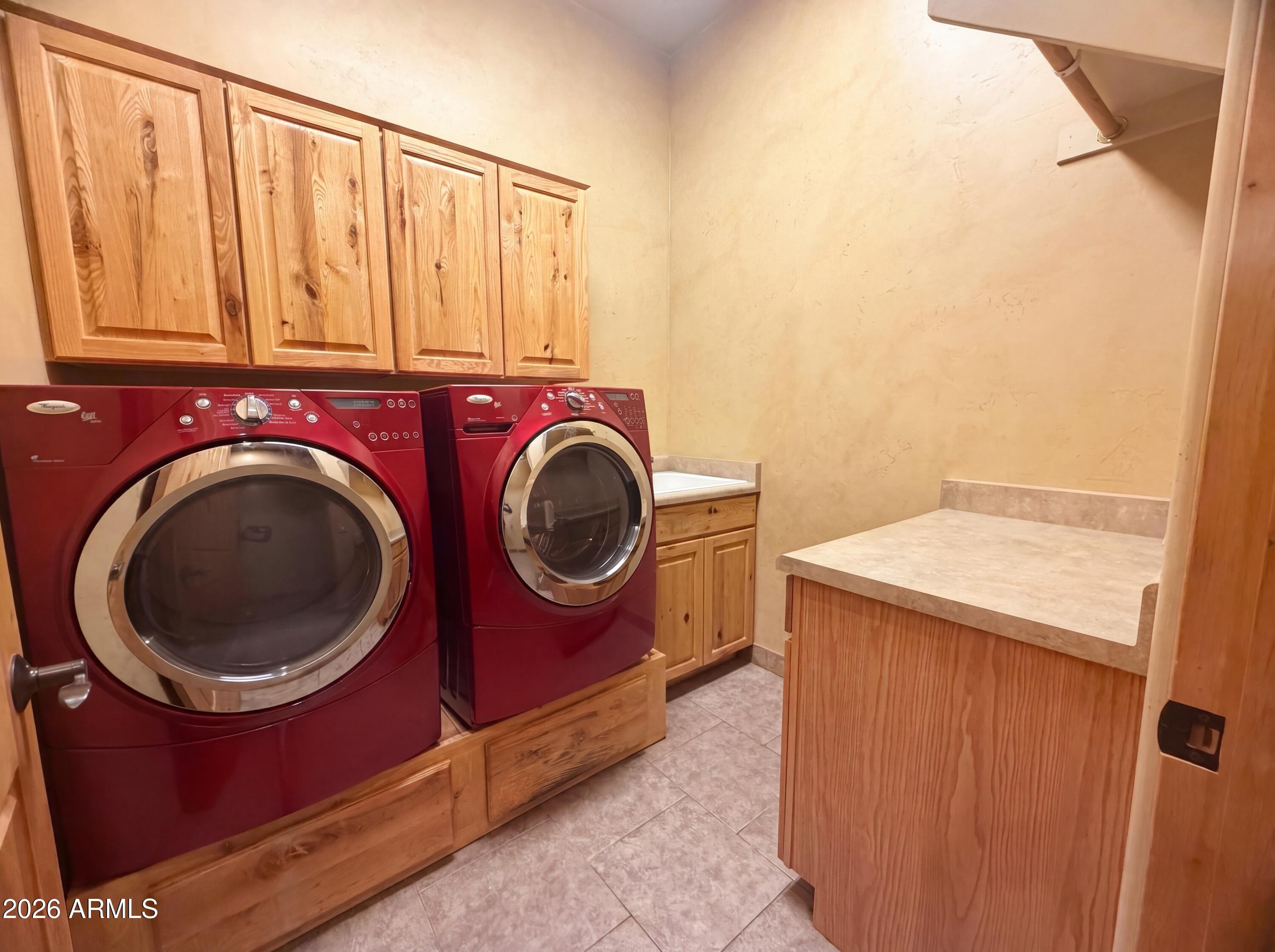 4496 South Kings Ranch Road Gold Canyon, AZ 85118 - Photo 14 of 22 a utility room with dryer and washer