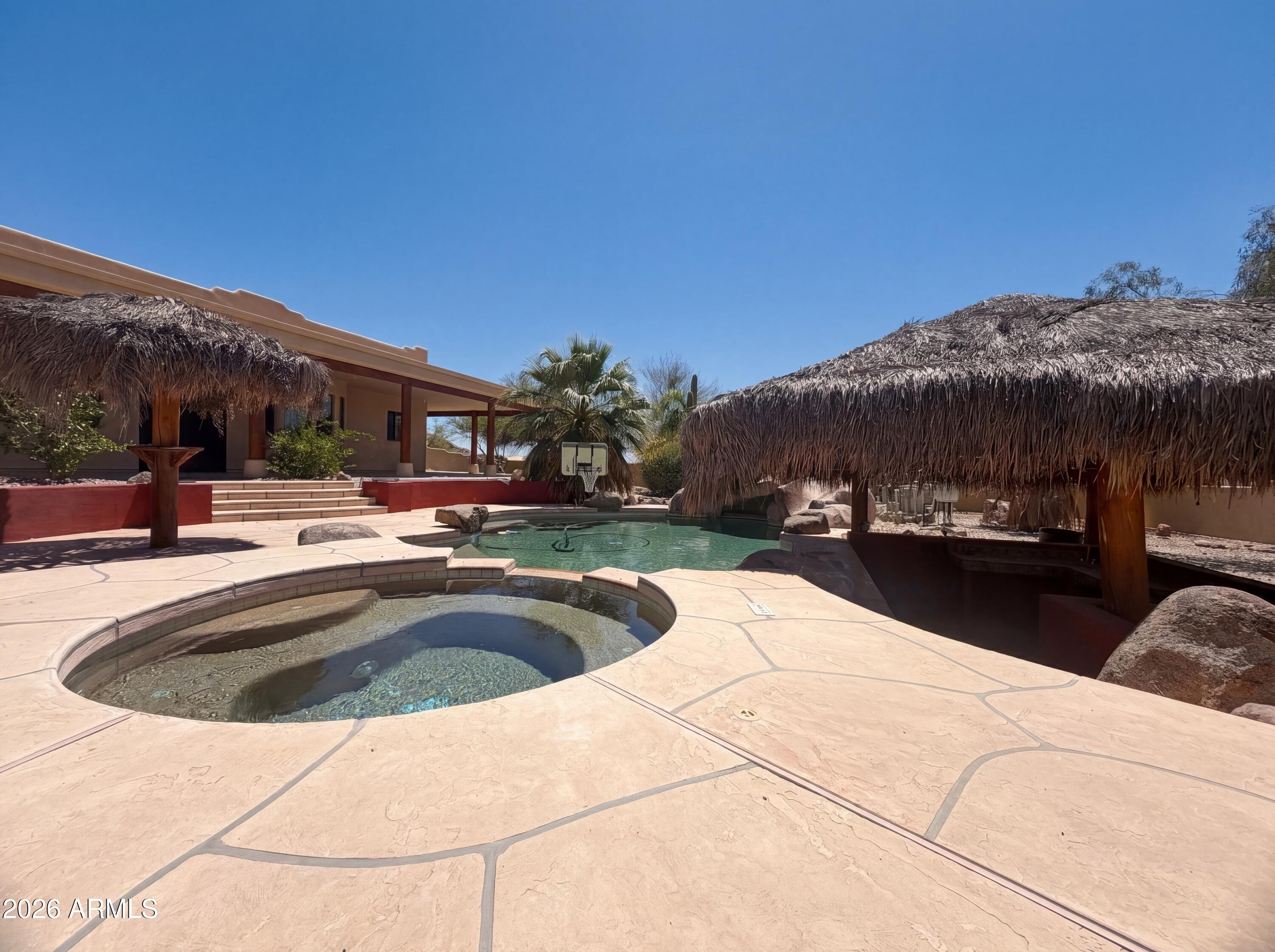 4496 South Kings Ranch Road Gold Canyon, AZ 85118 - Photo 18 of 22 a view of outdoor space with swimming pool and furniture