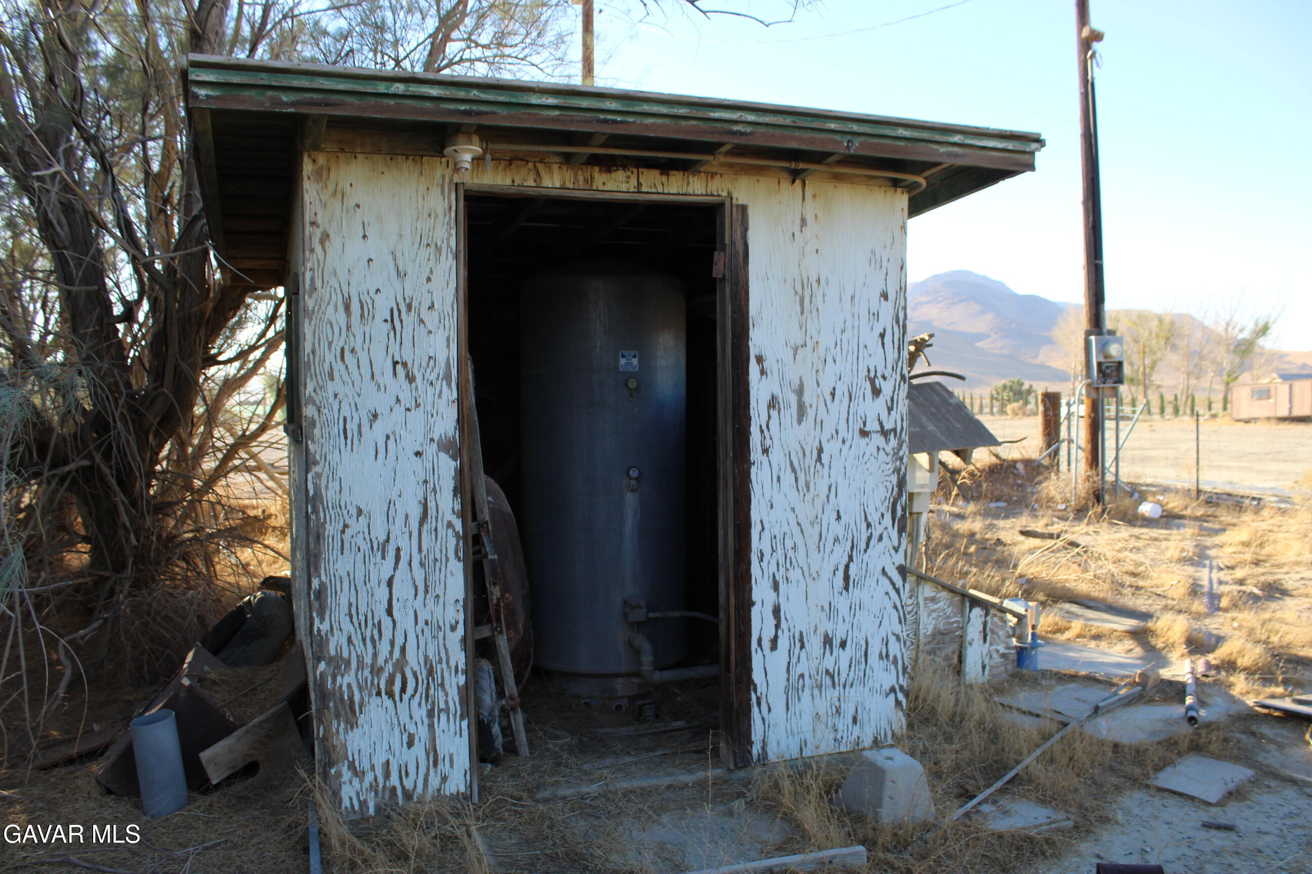 9485 Elberta Street Mojave, CA 93501 - Photo 10 of 12 a view of a wooden door of the house