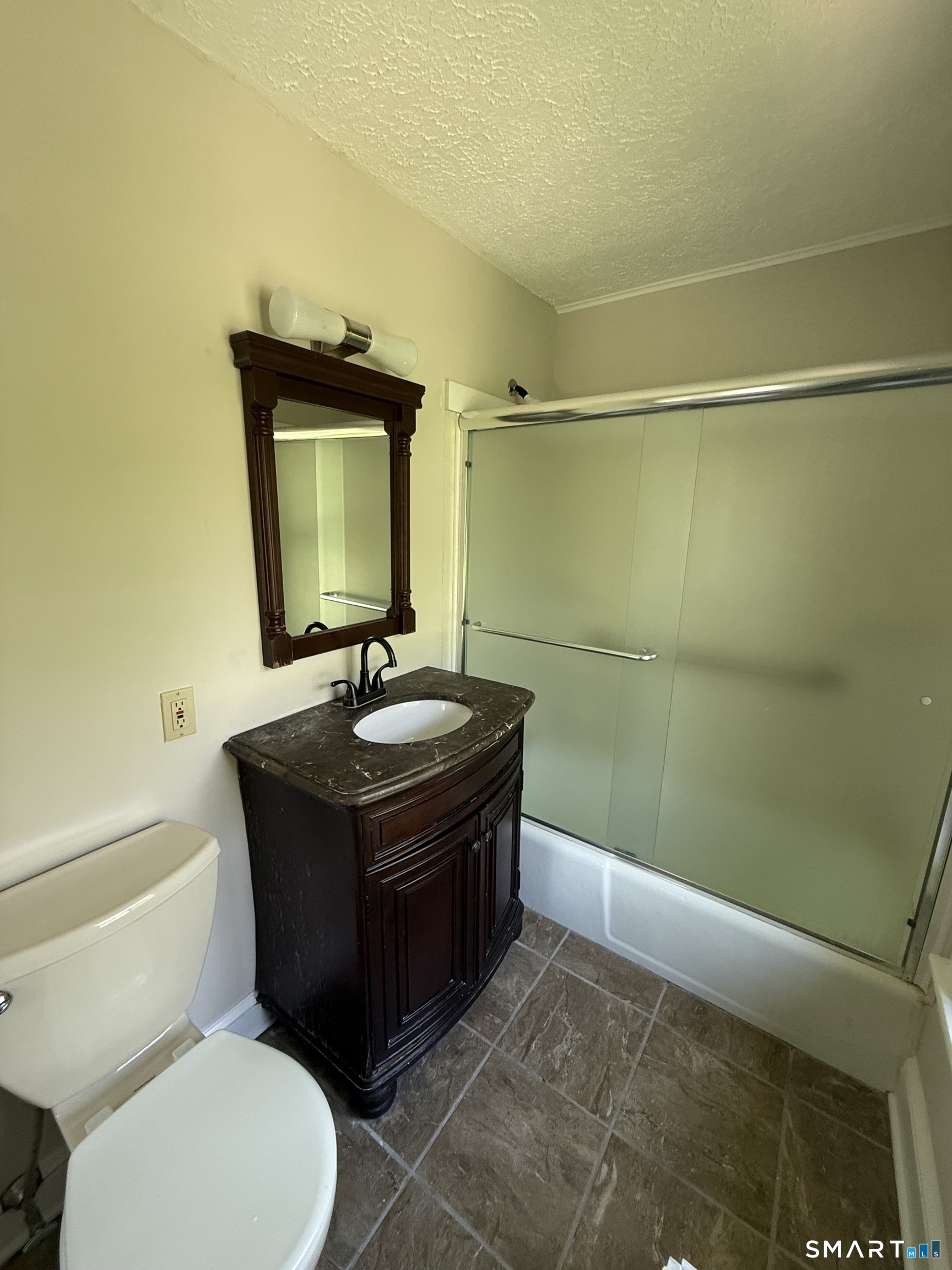 312 Ferry Road Old Lyme, CT 06371 - Photo 12 of 16 a bathroom with a sink toilet and mirror