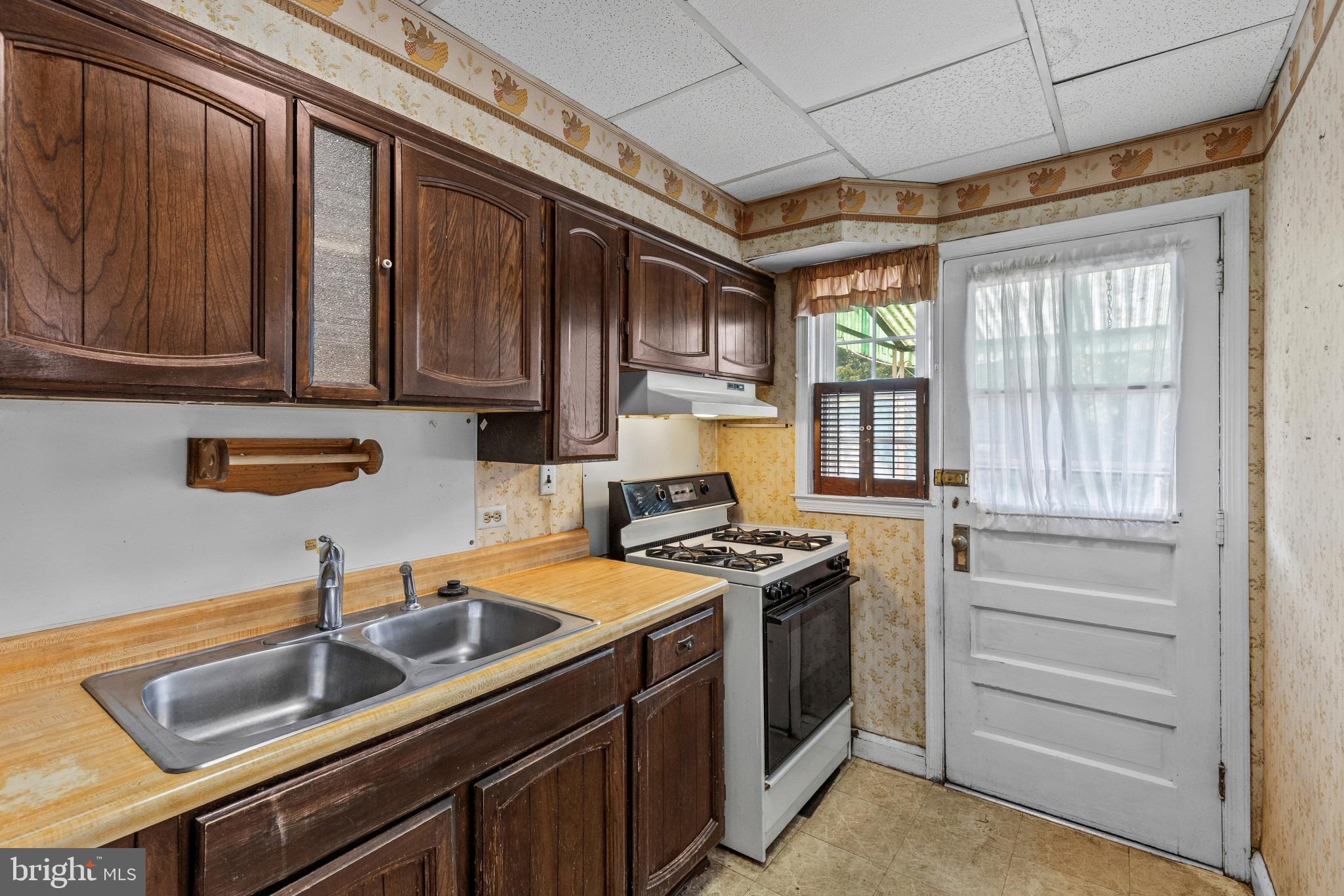 1957 Quentin Road Baltimore, MD 21222 - Photo 12 of 33 Kitchen with Access to Deck