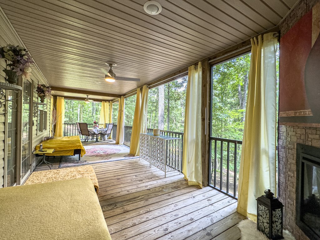 89 Box Turtle Lane Murphy, NC 28906 - Photo 5 of 51 a balcony with furniture and a fireplace