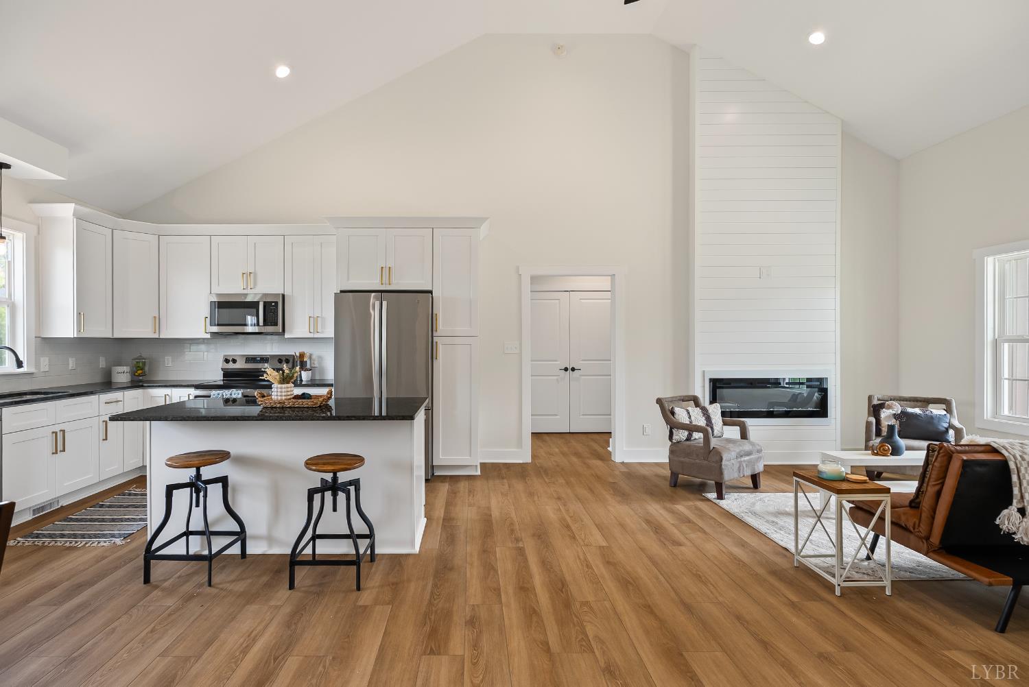 2 Hales Ford Road Moneta, VA 24121 - Photo 18 of 39 a kitchen with stainless steel appliances a dining table chairs stove microwave and cabinets