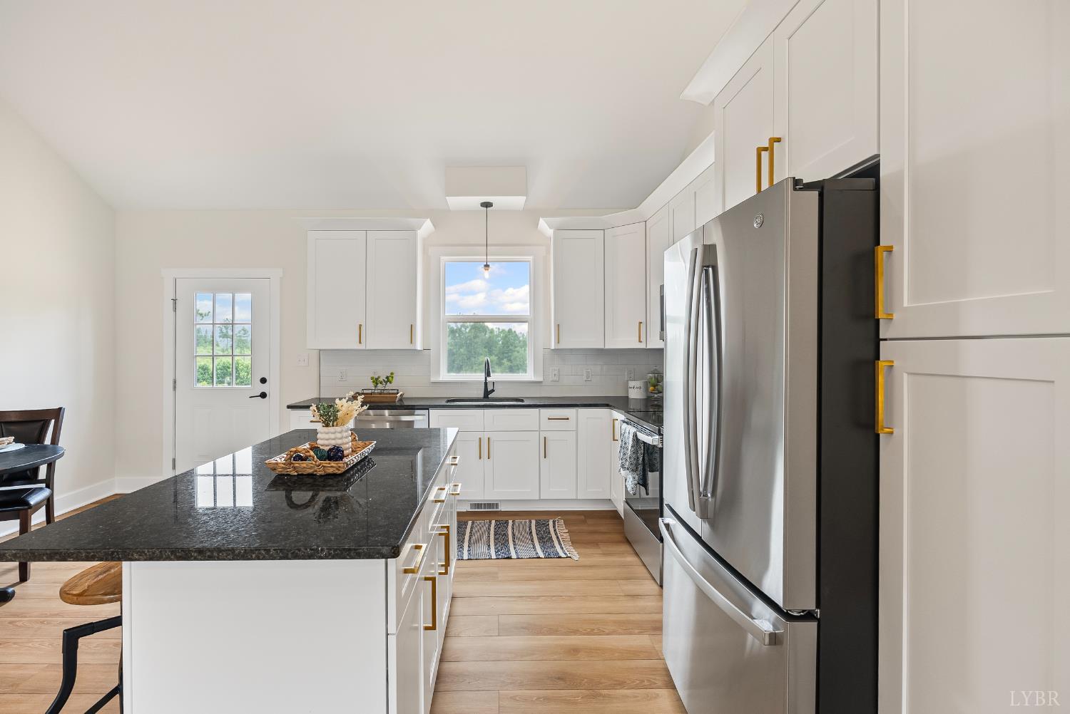 2 Hales Ford Road Moneta, VA 24121 - Photo 7 of 39 a kitchen with granite countertop a refrigerator a sink a stove and white cabinets