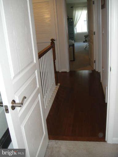 3405 Kemper Road Arlington, VA 22206 - Photo 17 of 30 a view of a hallway view with wooden floor and staircase