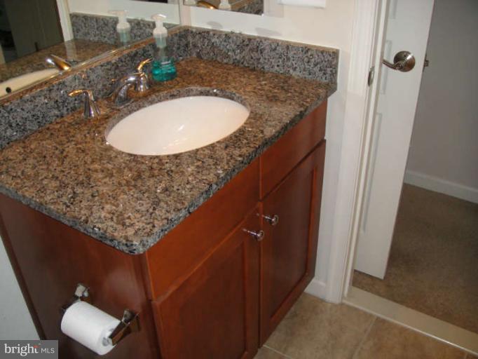 3405 Kemper Road Arlington, VA 22206 - Photo 19 of 30 a bathroom with a sink and a mirror