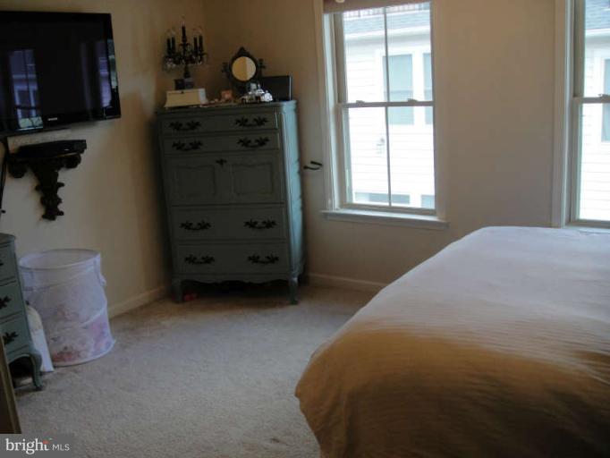 3405 Kemper Road Arlington, VA 22206 - Photo 21 of 30 a bedroom with a bed and a window