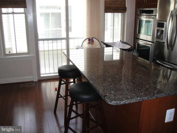 3405 Kemper Road Arlington, VA 22206 - Photo 25 of 30 a view of a dining room with furniture window and wooden floor