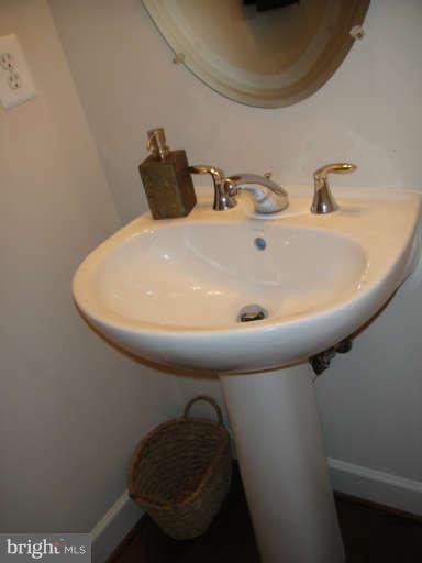 3405 Kemper Road Arlington, VA 22206 - Photo 10 of 30 a bathroom with a sink and mirror