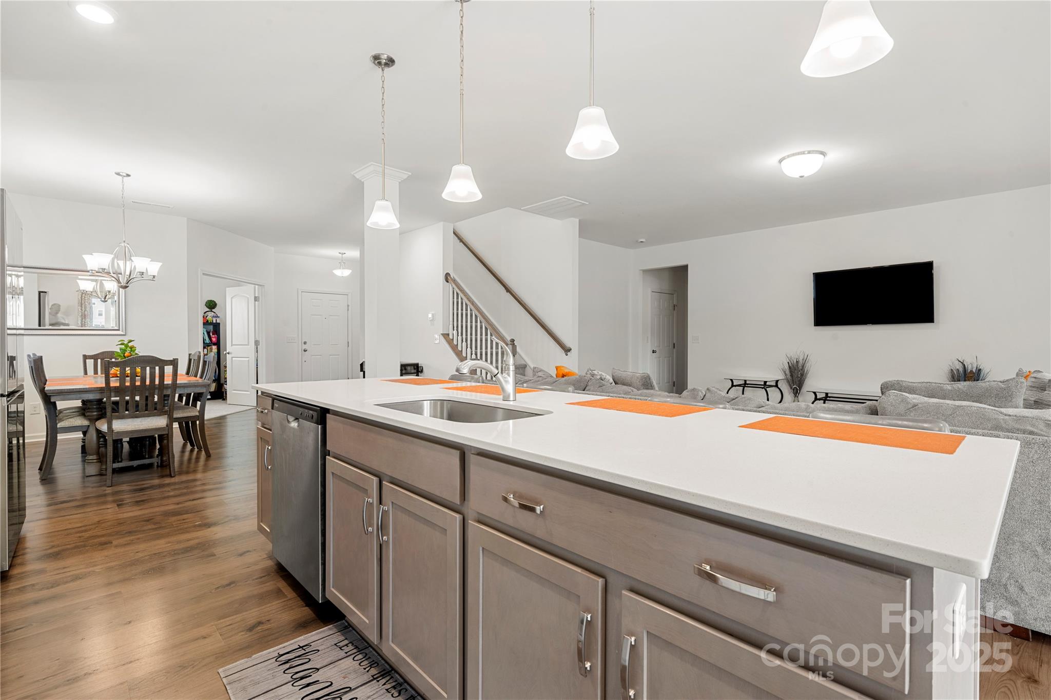12053 Sam Snead Court Lancaster, SC 29720 - Photo 12 of 48 a spacious kitchen with stainless steel appliances granite countertop a sink and a stove