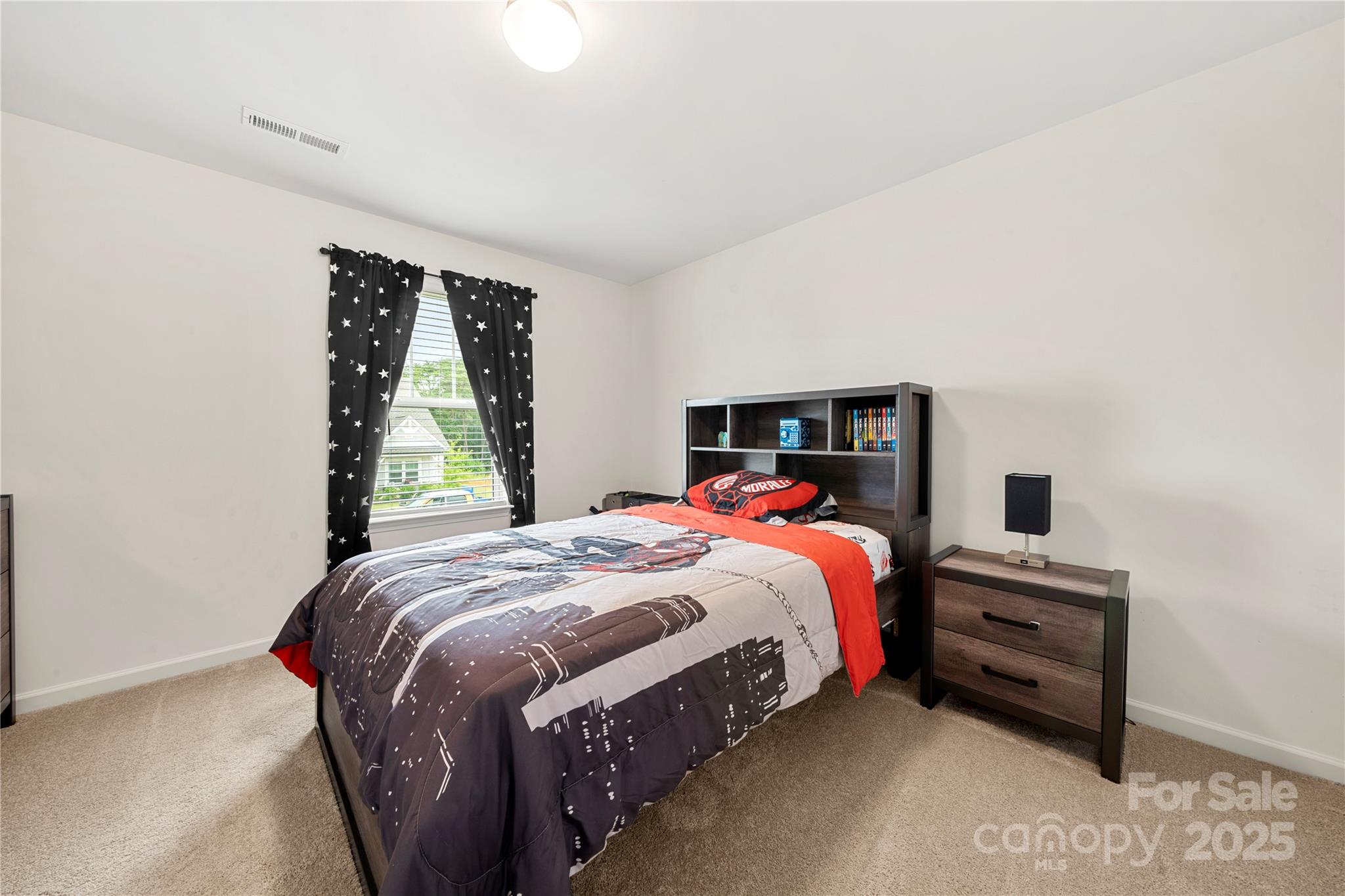 12053 Sam Snead Court Lancaster, SC 29720 - Photo 19 of 48 a bedroom with a bed and a window