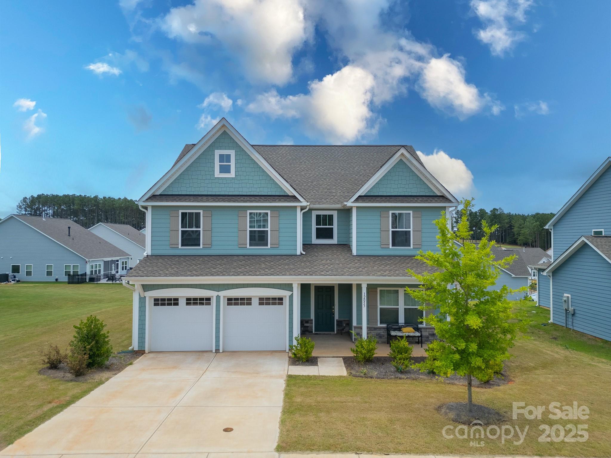 12053 Sam Snead Court Lancaster, SC 29720 - Photo 2 of 48 a front view of a house with garden