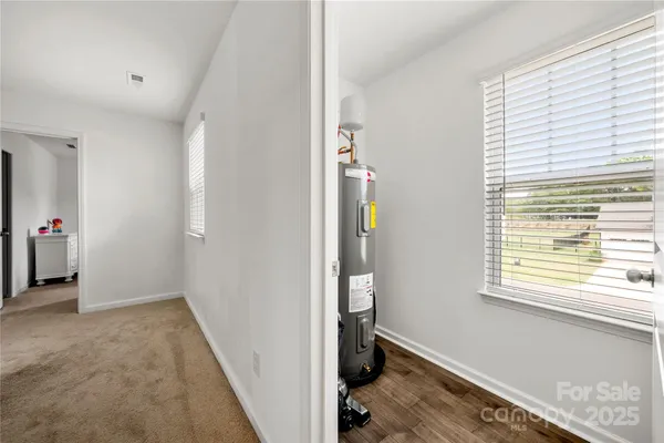 a view of utility room with a window