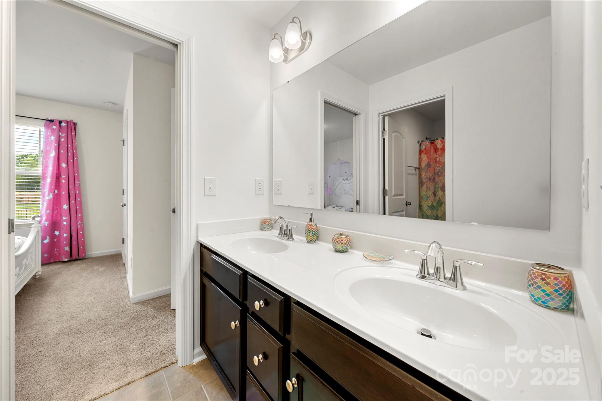 12053 Sam Snead Court Lancaster, SC 29720 - Photo 26 of 48 a en suite bathroom with a double vanity sink and a mirror