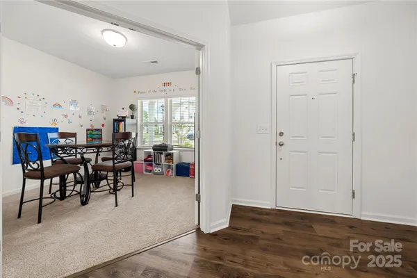 a view of a livingroom with furniture and workspace