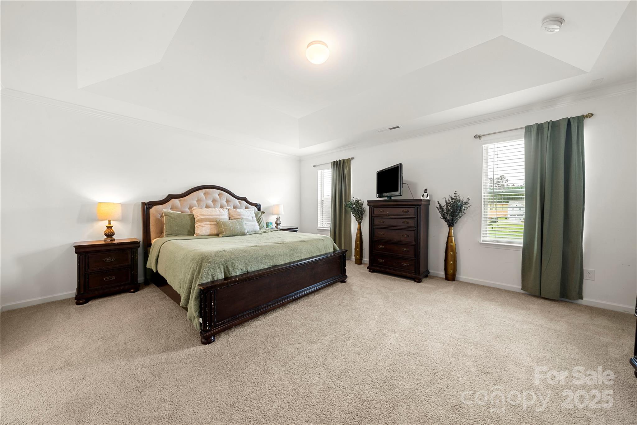 12053 Sam Snead Court Lancaster, SC 29720 - Photo 32 of 48 a bedroom with a bed and a television