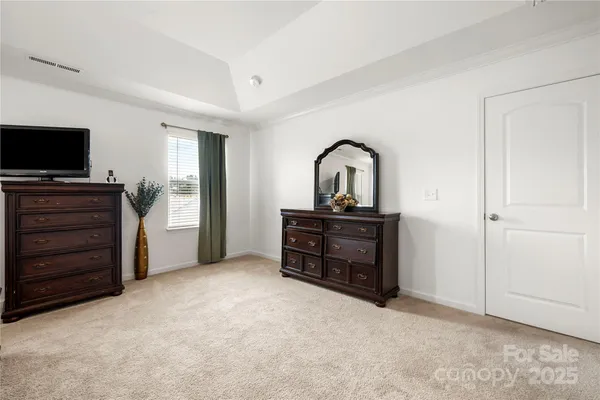 a room with furniture and a flat screen tv