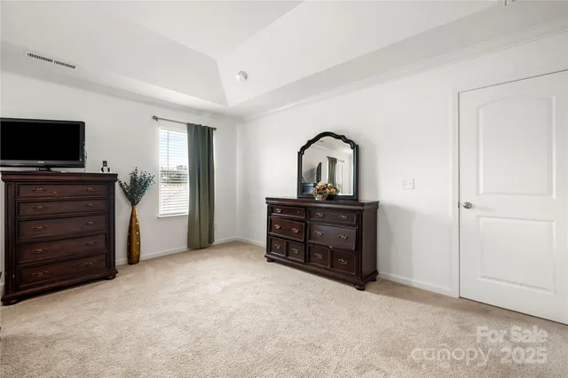 a room with furniture and a flat screen tv