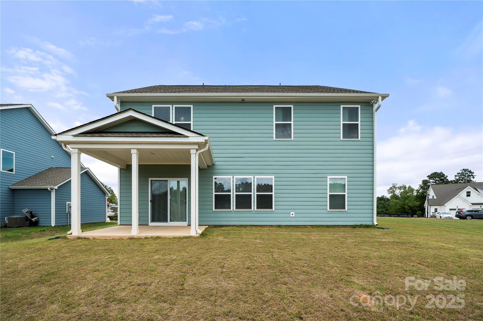 12053 Sam Snead Court Lancaster, SC 29720 - Photo 41 of 48 a front view of a house with a garden