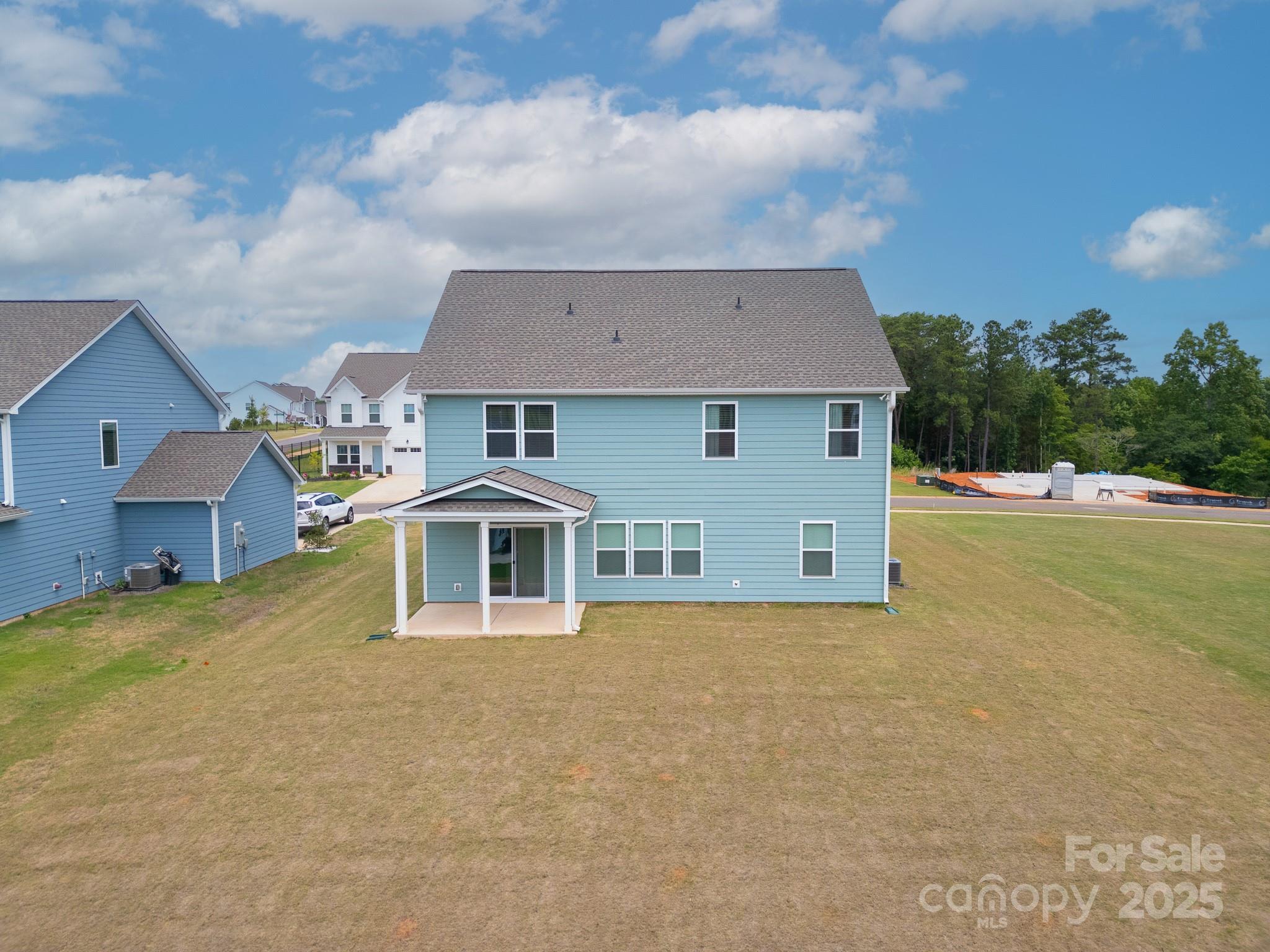 12053 Sam Snead Court Lancaster, SC 29720 - Photo 42 of 48 a front view of a house with a yard and garage