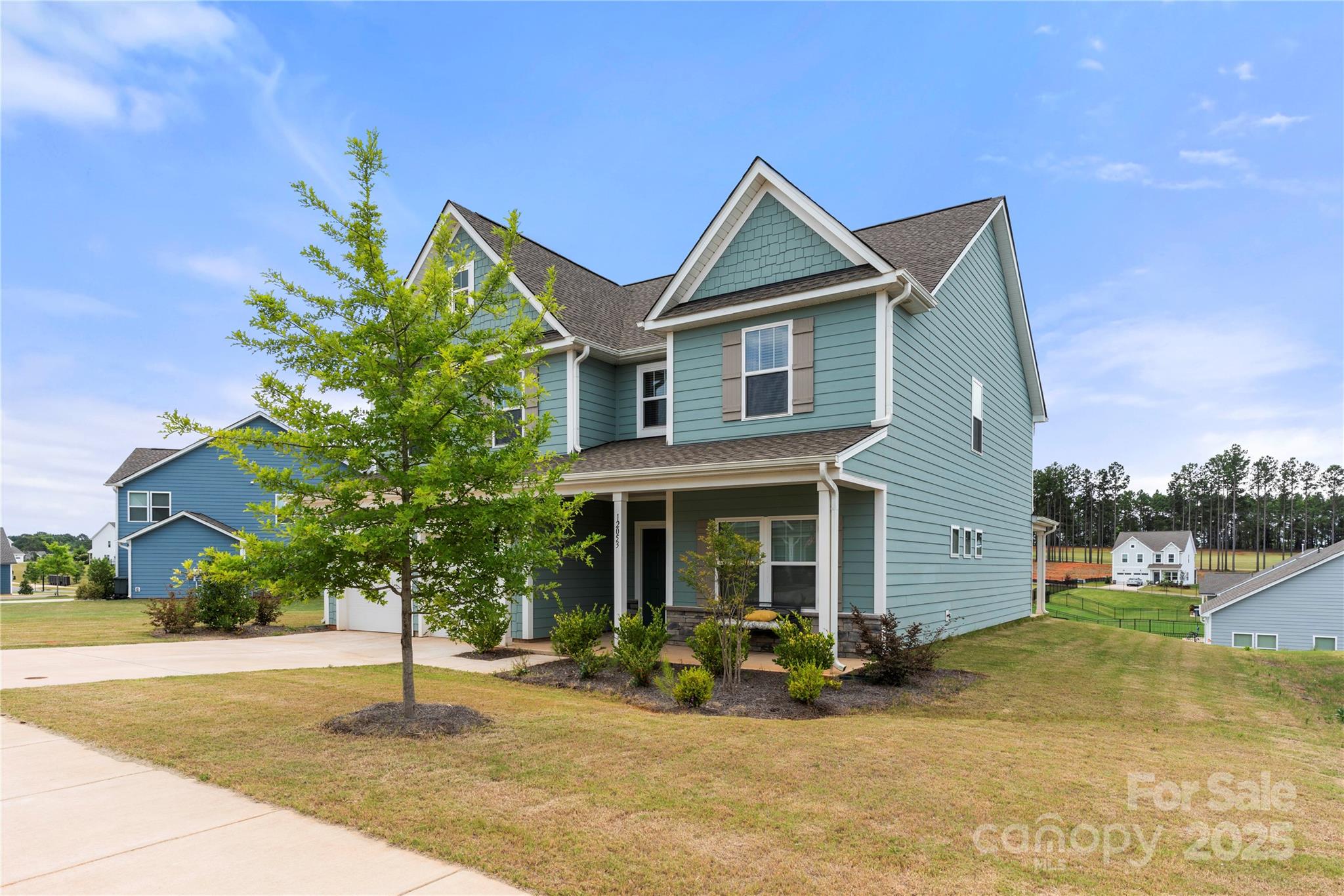 12053 Sam Snead Court Lancaster, SC 29720 - Photo 44 of 48 a front view of a house with garden