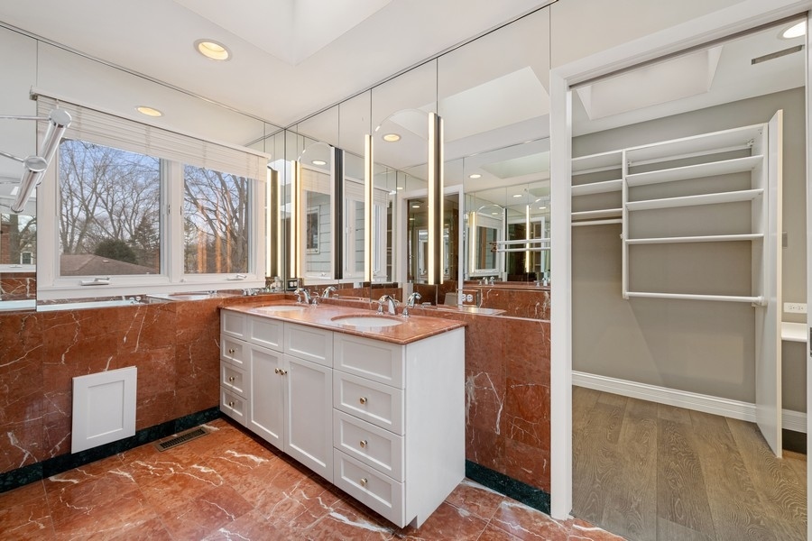 643 Robin Lane Glencoe, IL 60022 - Photo 25 of 32 a bathroom with a sink double vanity and a mirror
