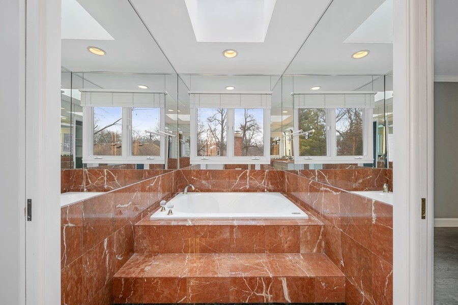 643 Robin Lane Glencoe, IL 60022 - Photo 26 of 32 a large swimming pool with large glass windows and painted walls