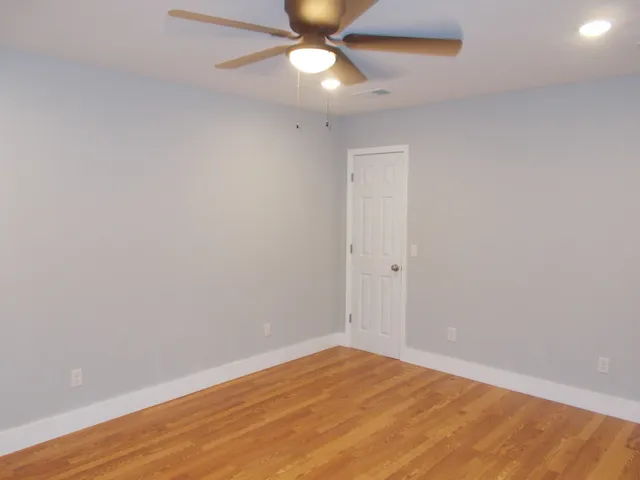 a bathroom with a sink toilet and a mirror