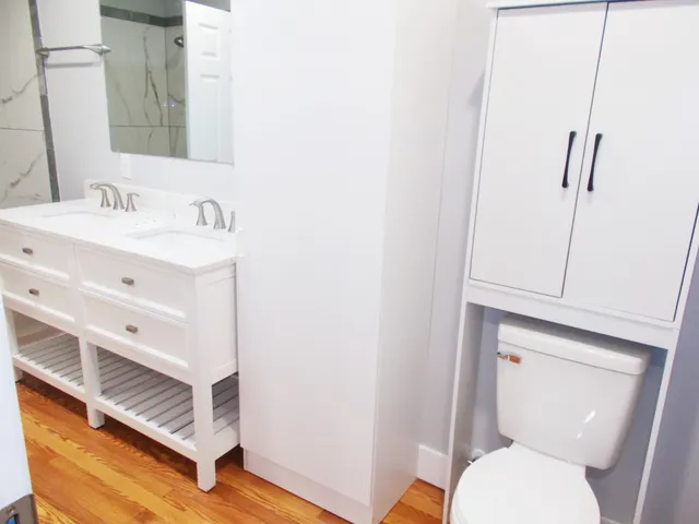 a bathroom with a tub a sink and a shower