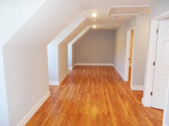 a view of a room with wooden floor