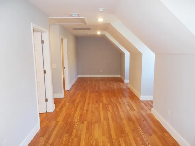 a view of an entryway with wooden floor