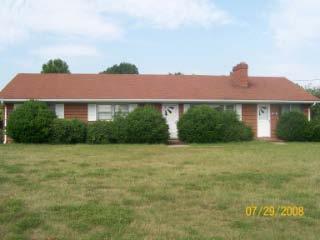 1254 Goodview Road Goodview, VA 24095 - Photo 1 of 1 a front view of a house with a yard