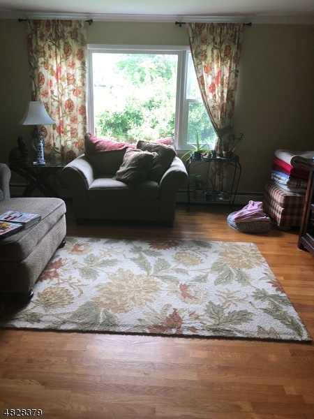 79 Rock Road, Unit 2 Hawthorne, NJ 07506 - Photo 13 of 13 a living room with furniture window and a floor to ceiling window