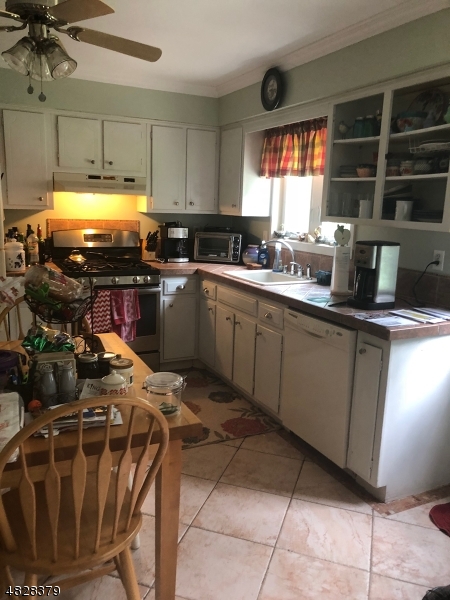79 Rock Road, Unit 2 Hawthorne, NJ 07506 - Photo 3 of 13 a kitchen with sink cabinets and window