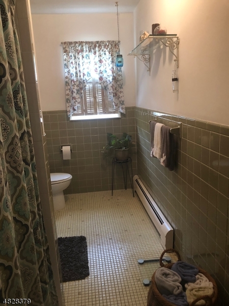 79 Rock Road, Unit 2 Hawthorne, NJ 07506 - Photo 5 of 13 a bathroom with a sink and a toilet