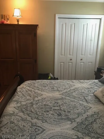 a bedroom with a wooden bed