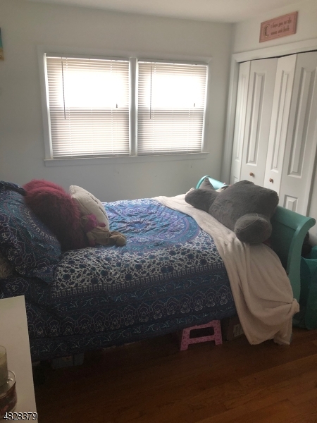 79 Rock Road, Unit 2 Hawthorne, NJ 07506 - Photo 10 of 13 a bedroom with a bed and window