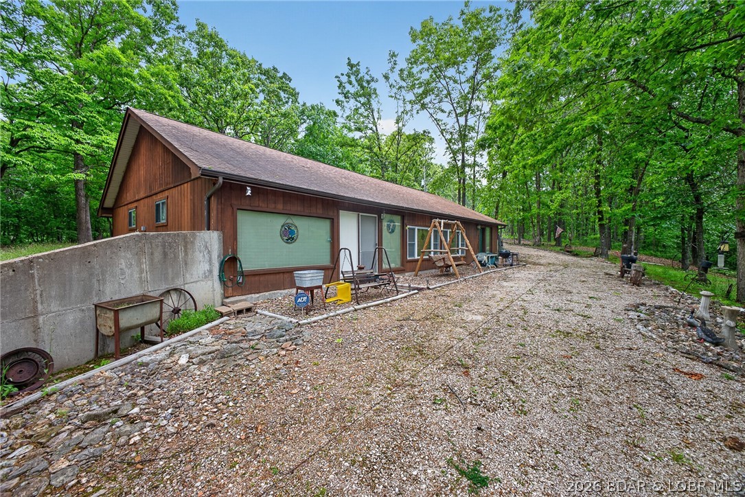 16376 Twisted Tree Road Barnett, MO 65011 - Photo 27 of 65 Gravel driveway circles the home