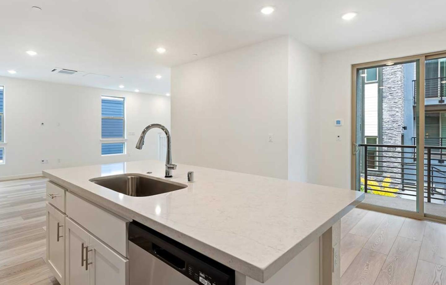 6681 Optimum Loop San Jose, CA 95119 - Photo 18 of 33 a kitchen with a sink and a refrigerator