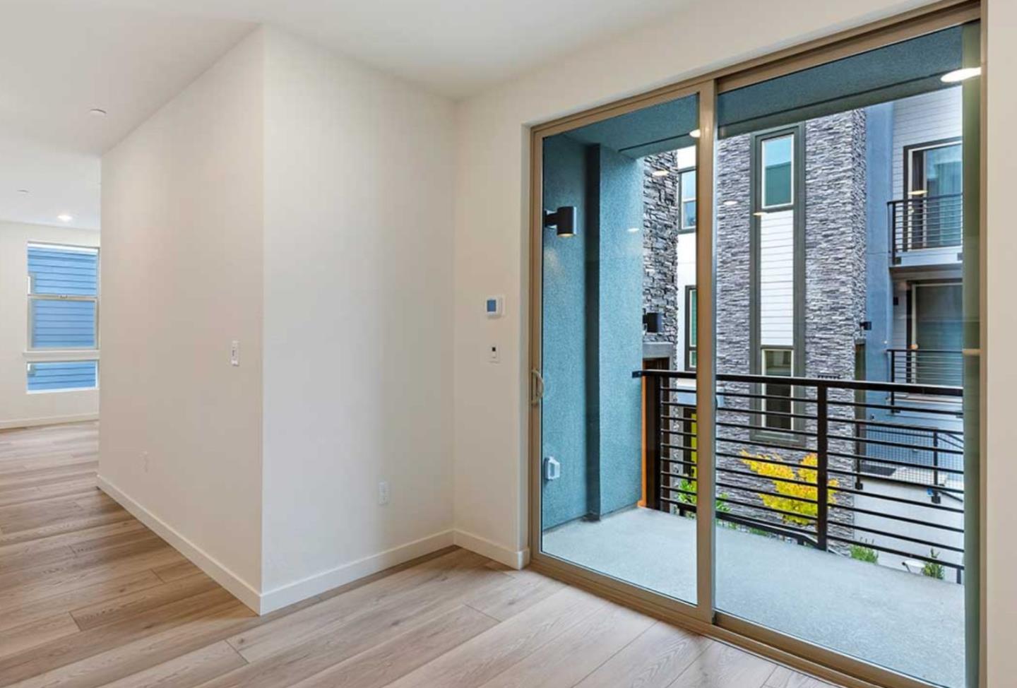 6681 Optimum Loop San Jose, CA 95119 - Photo 19 of 33 a view of room with window and wooden floor
