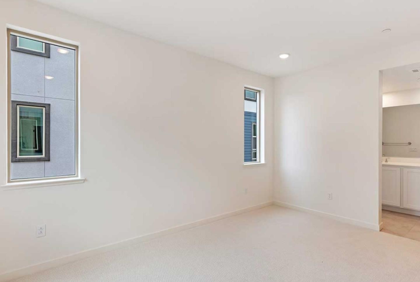 6681 Optimum Loop San Jose, CA 95119 - Photo 22 of 33 an empty room with windows and closet