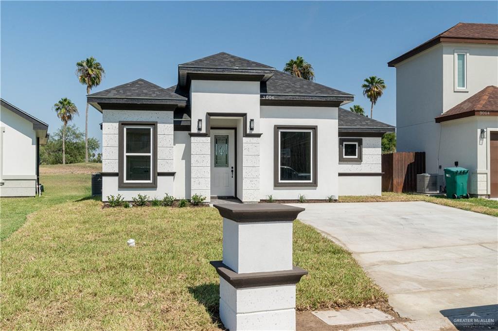 3006 Rhett Drive Pharr, TX 78577 - Photo 1 of 1 View of front of property featuring cooling unit and a front yard