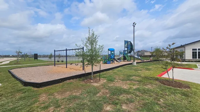 a view of a field with an ocean view