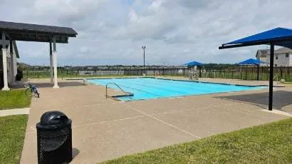 a view of a swimming pool with seating area
