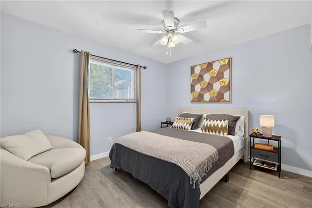 a bedroom with a bed and a couch